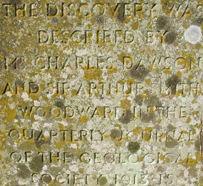 Bottom of monument inscription.