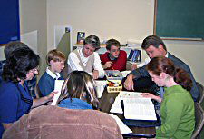 Students and parents studying Genesis