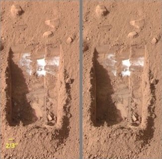Ice on Mars in trench dug by Phoenix lander (NASA)