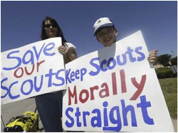 Scout holding up sign