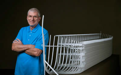 Ken Ham next to Ark model