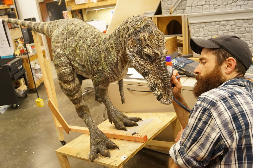 Joel Briggs Painting a Dinosaur