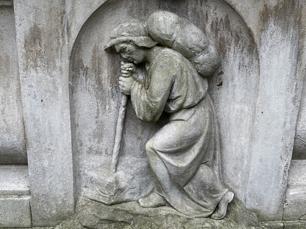 Grave with man carrying