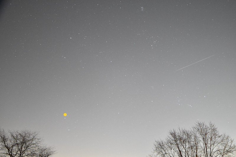 Long, upward-moving meteor above Orion