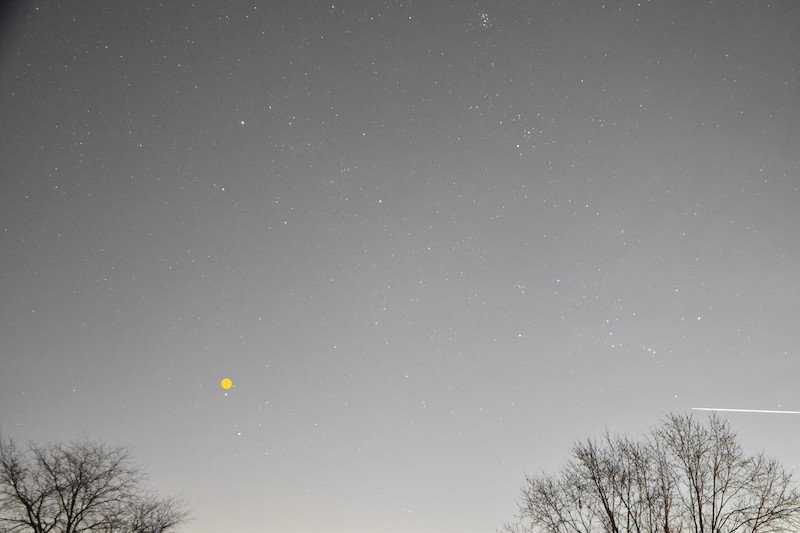 Bright, nearly horizontal meteor to the lower right of Orion