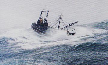 A fishing vessel in a following sea