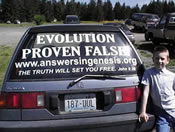 Answers in Genesis advertisement on a rear window