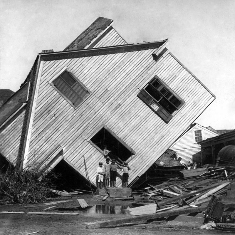 house on its side after hurricane