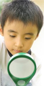 Child with Magnifying Glass