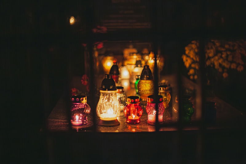 a table with many lit candles on it