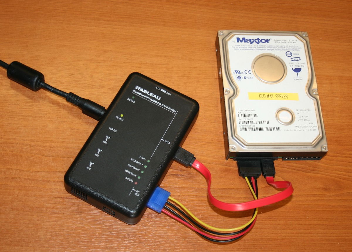 A digital forensic tool called a write-blocker attached to a hard drive