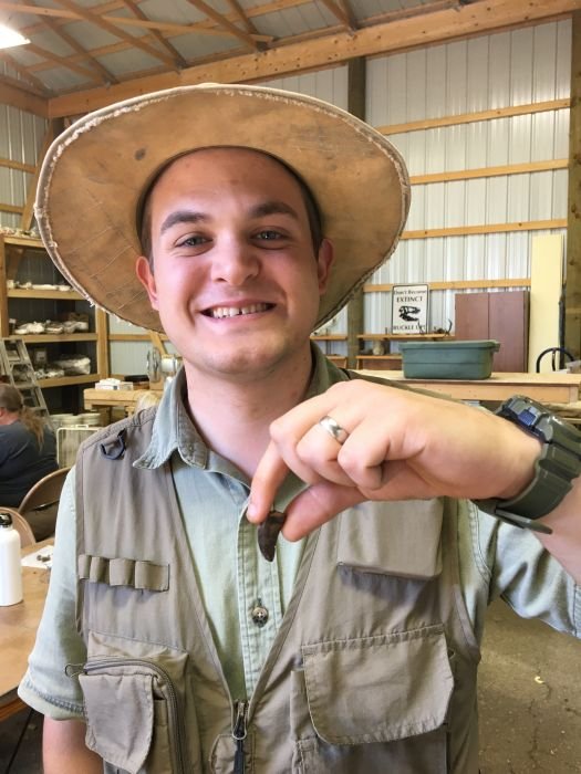 Kyle with juvenile T. rex tooth