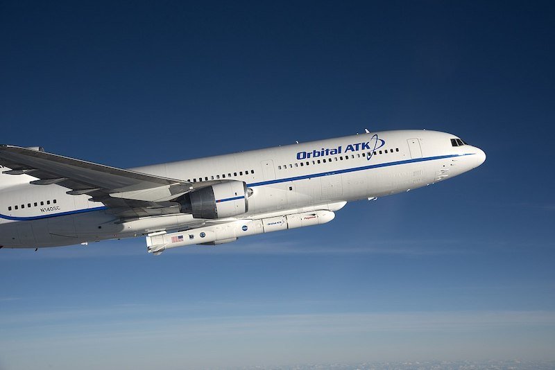 L-1011 Stargazer aircraft, carrying a Pegasus XL rocket beneath it, which drops from the aircraft to launch.