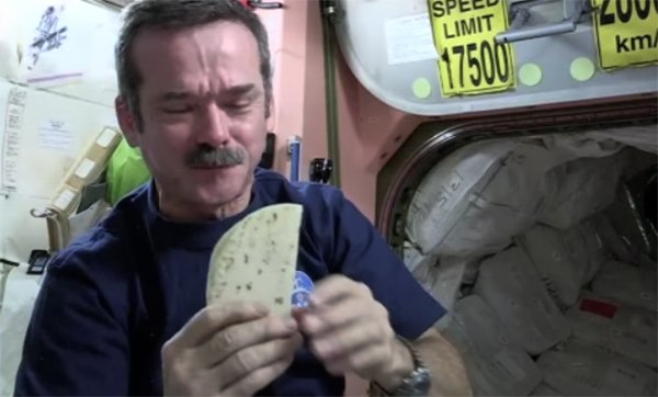 Photo of Astronaut Chris Hadfield making a 'space burrito'