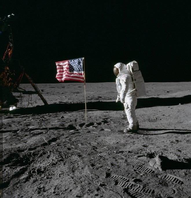 Aldrin standing by US flag