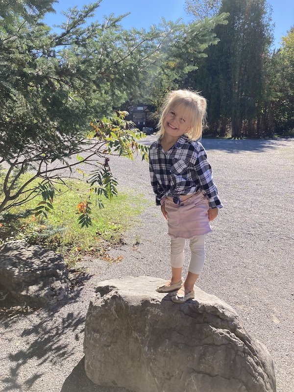 Felicity standing on a rock