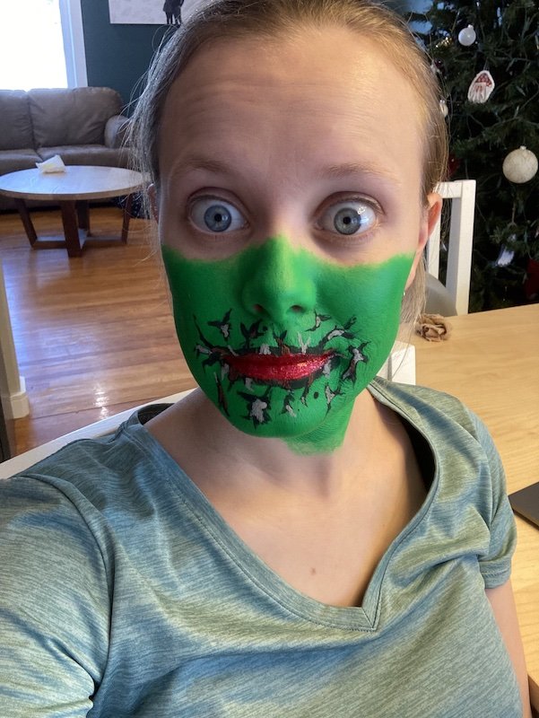Avery with face painted green.