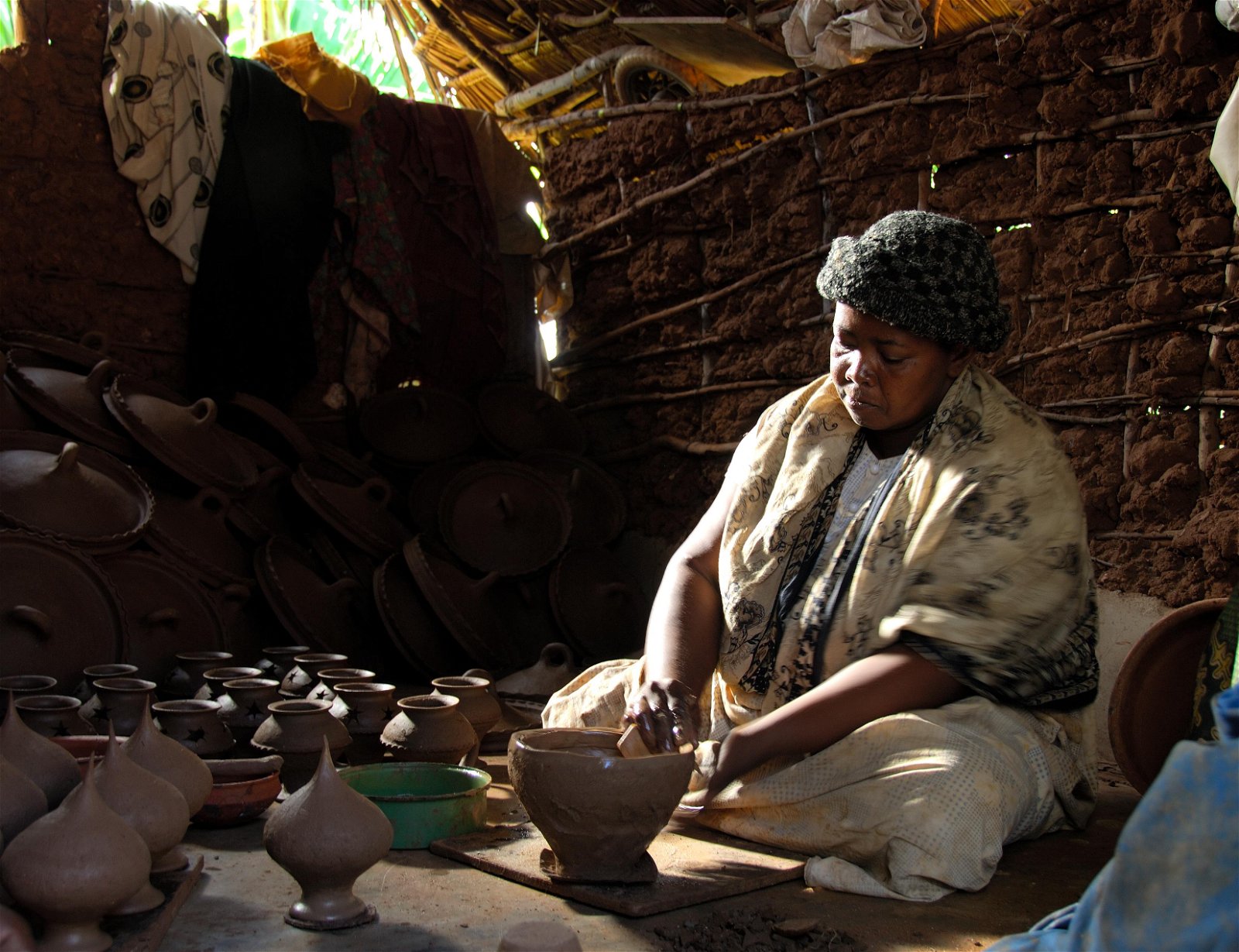 Tanzanian woman making pottery
