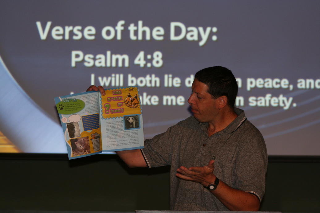 Eitan showing the AiG creation article that appears in each issue of their Hebrew magazine