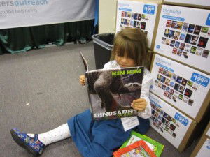 Girl Reading Dinosaurs for Kids