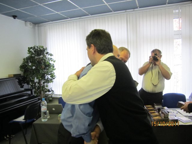 One of the Russian pastors receiving the DVDs from Steve.