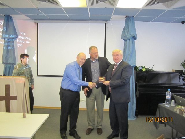 Steve presenting the first copy of the DVDs to the president of the Baptist Union of Russia, Alexiy Smirnov.