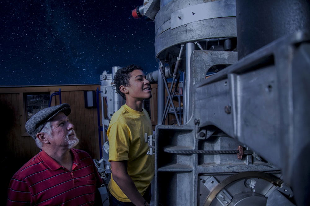 Looking through a telescope at the Creation Museum