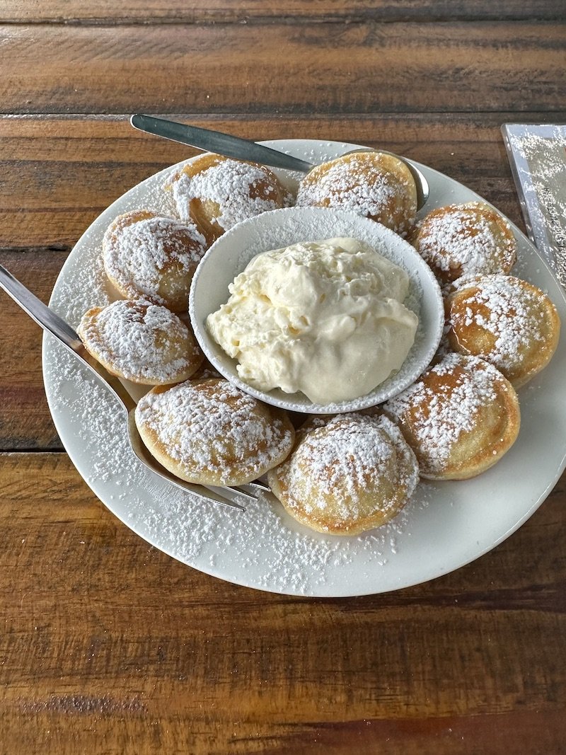 Poffertjes with maple syrup and cream