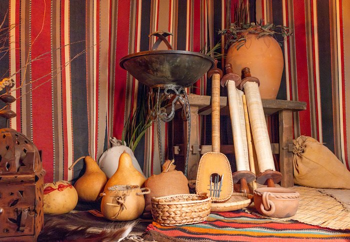 Scrolls, instruments, baskets, and gourds