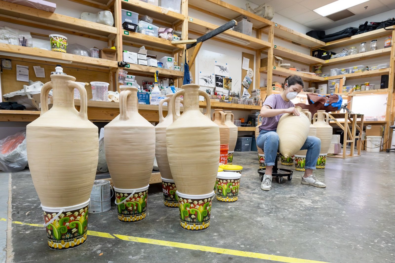 Artist refining the pottery