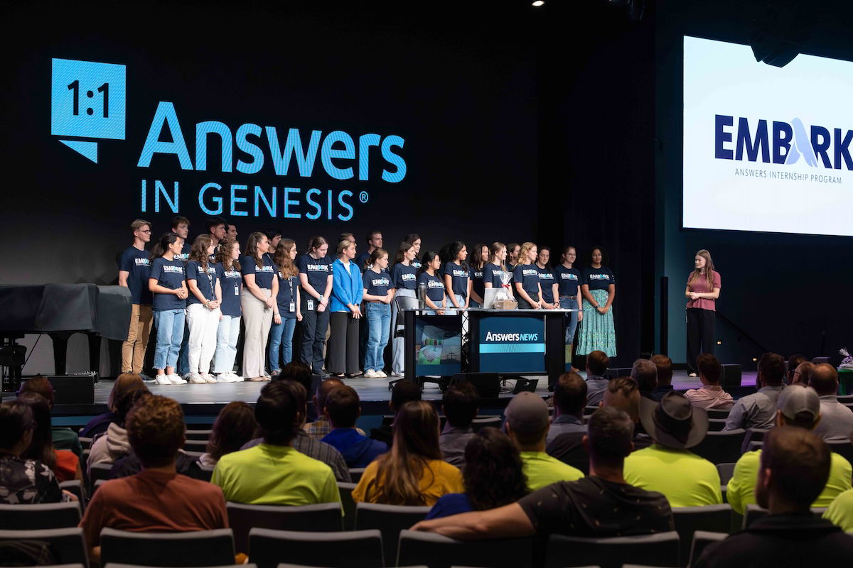 Interns on stage at staff meeting