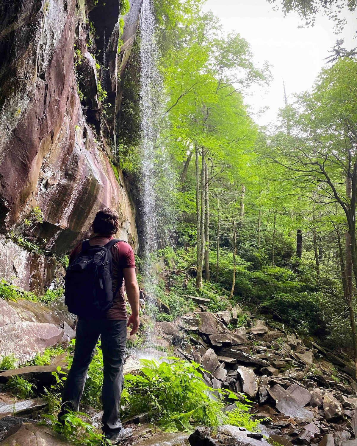 Peter next to a waterfall