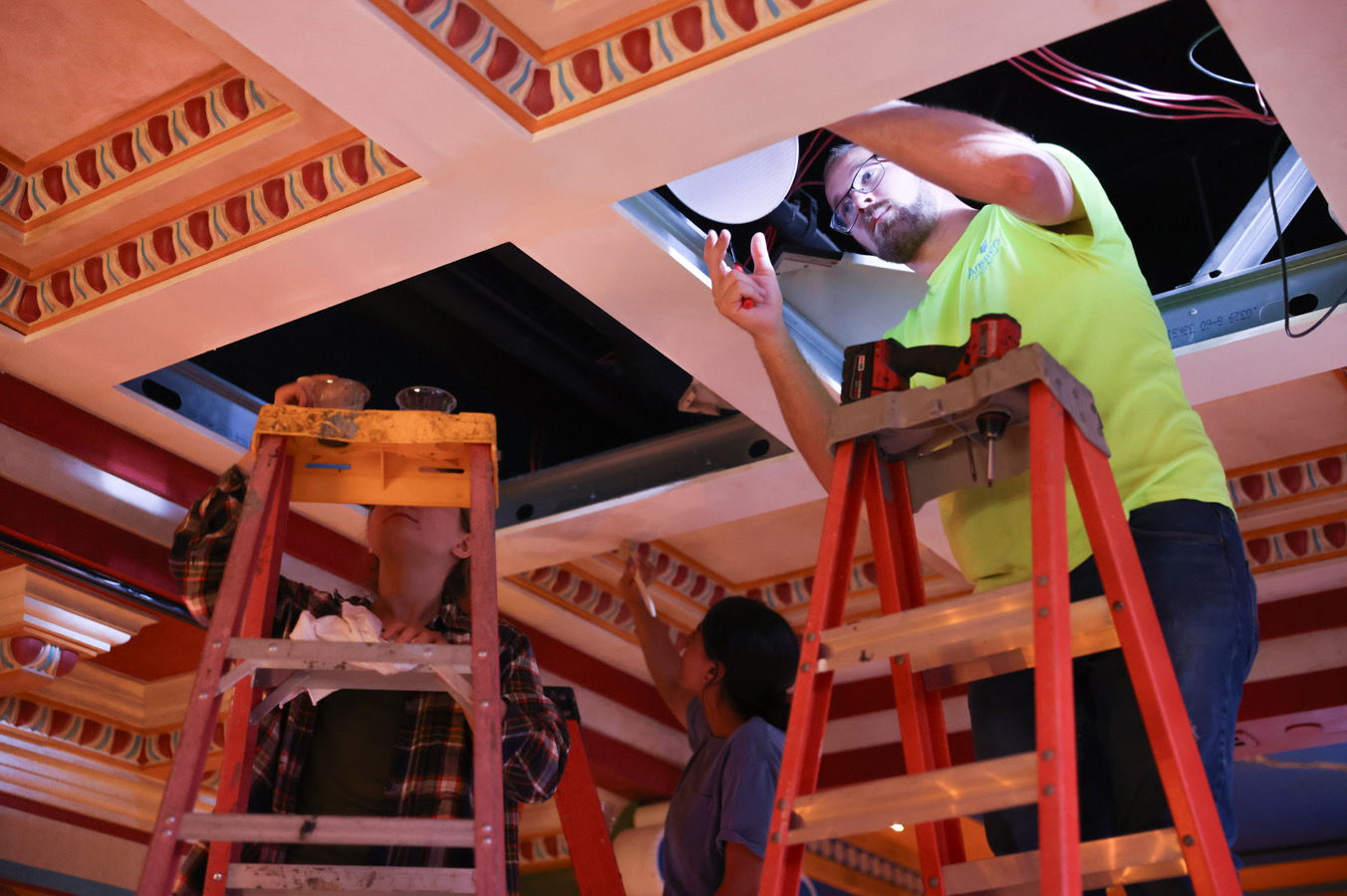 Ceiling tiles being installed