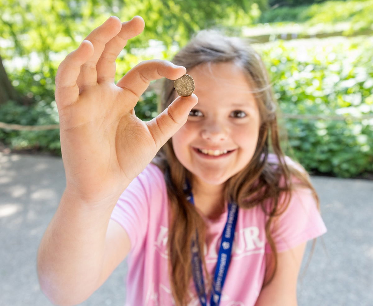 Girl holding an artifact she found