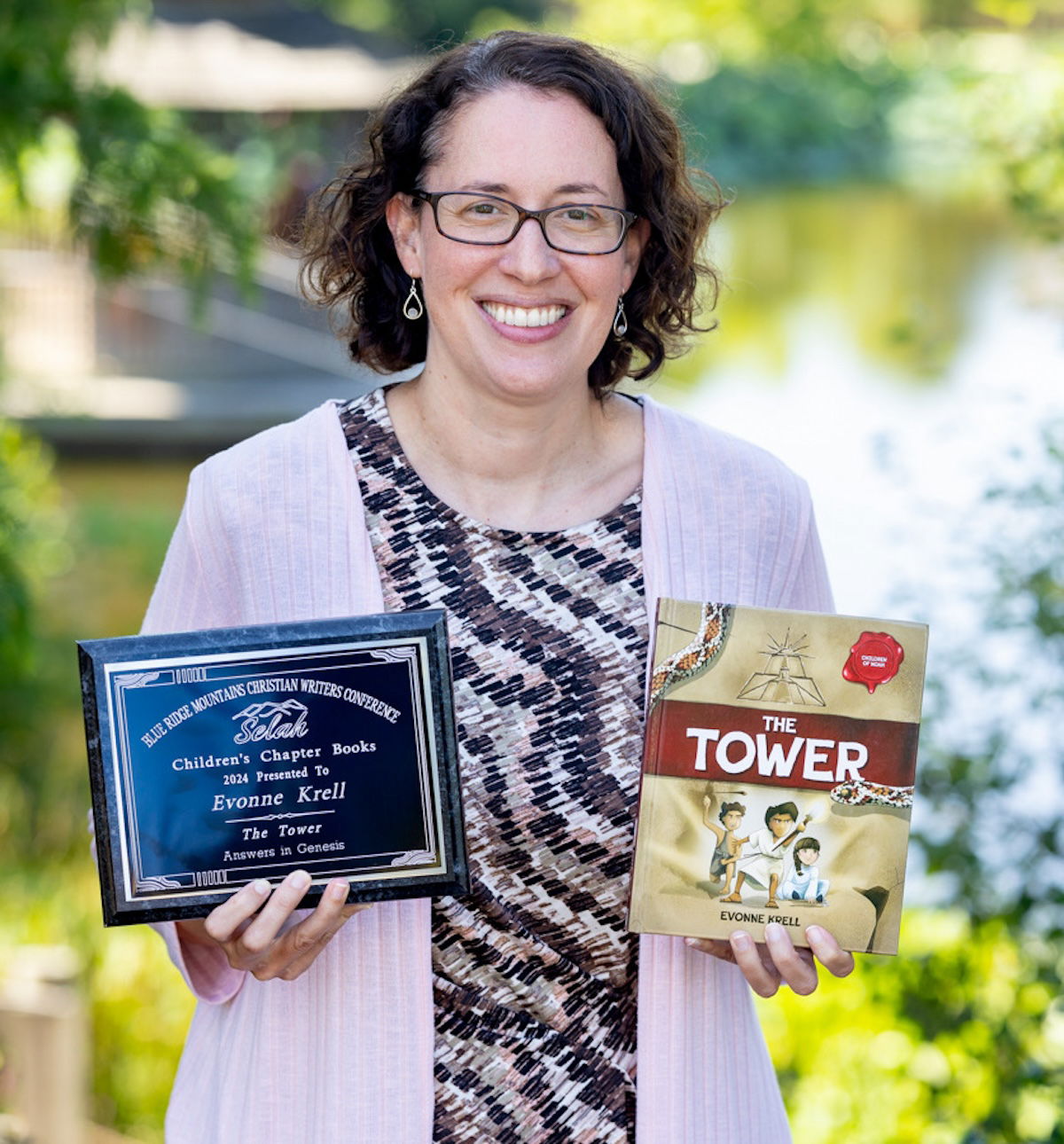 Evone Krell with the award and book