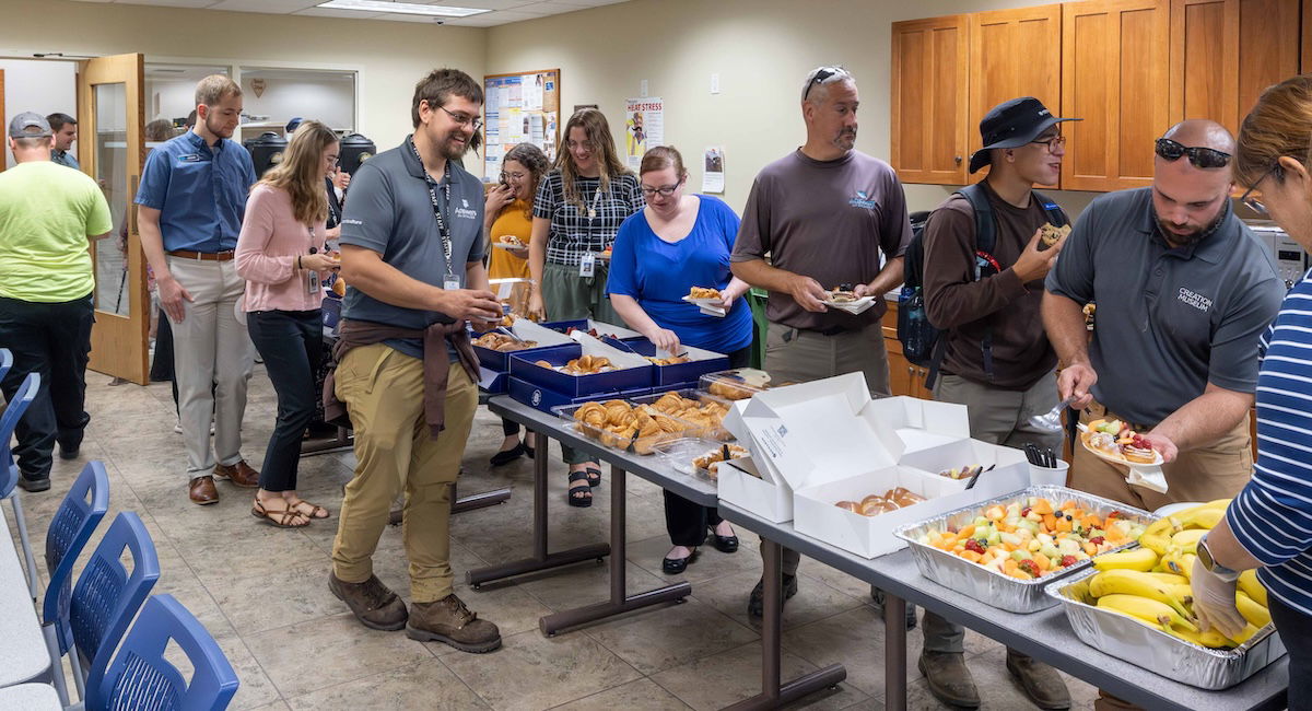 Employees in breakroom with food