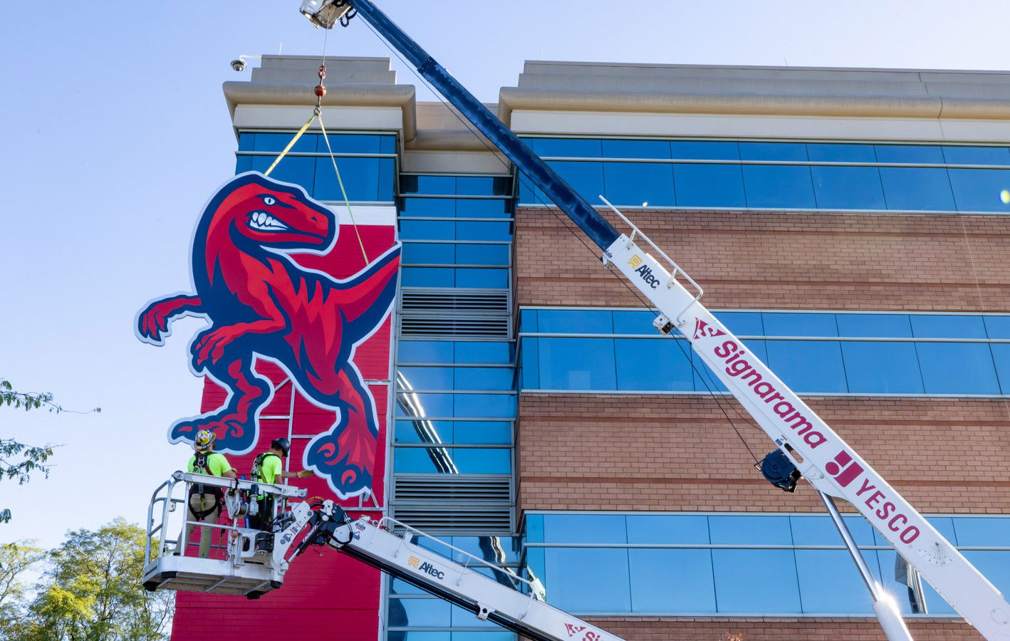 Raptor mascot sign lifted up