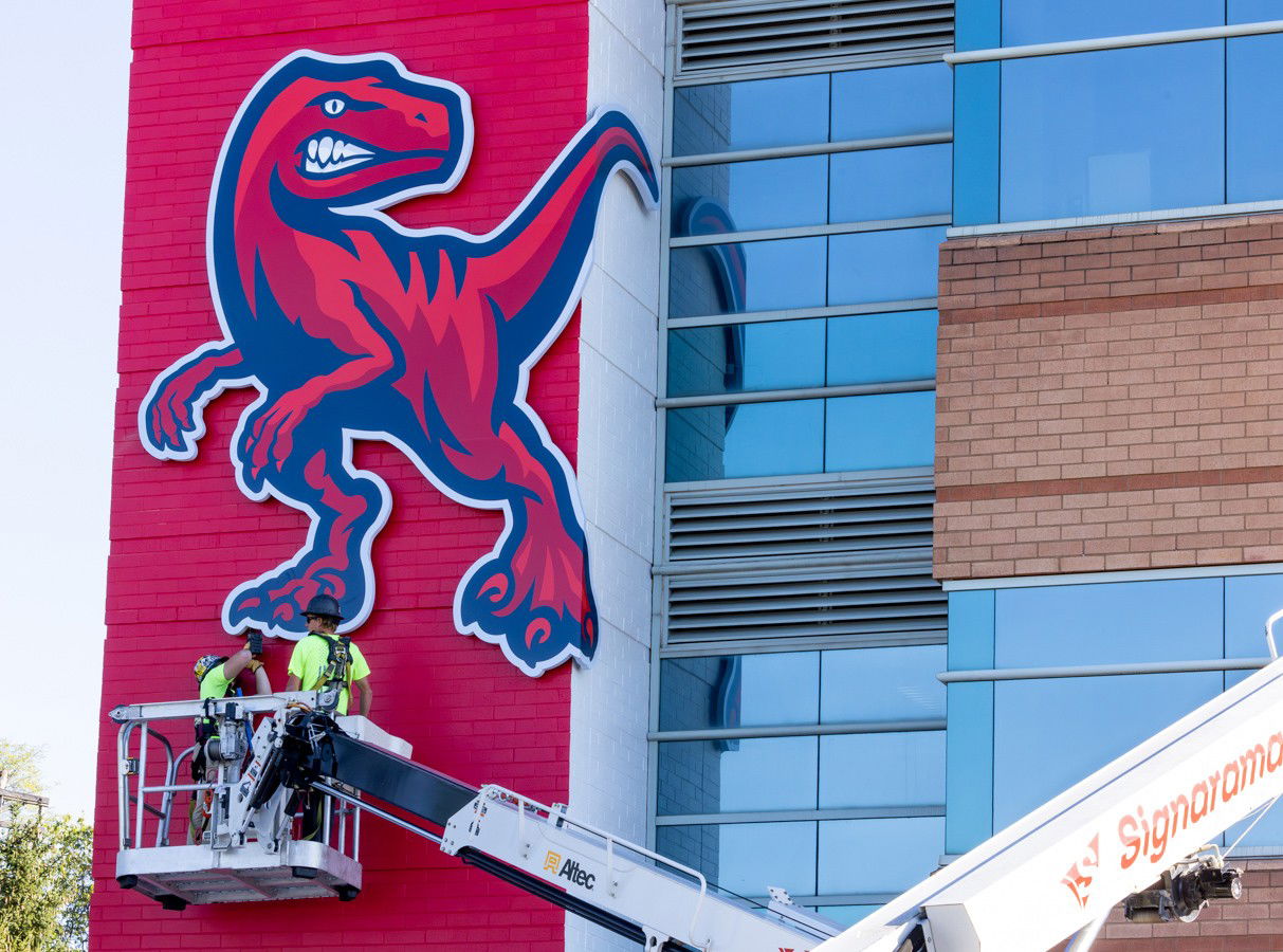 Raptor mascot sign installed on wall