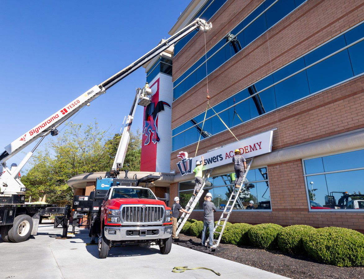 Answers Academy sign being installed