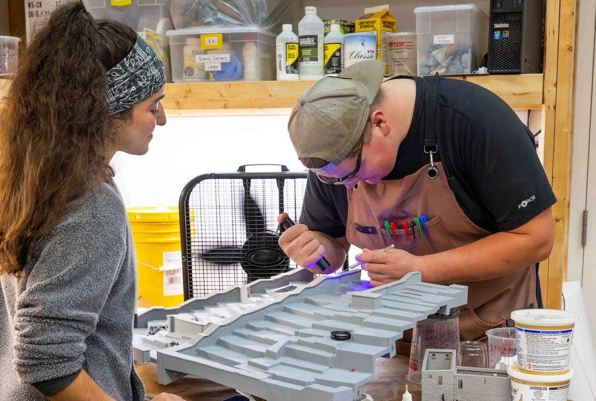 Artists assembling Jerusalem model