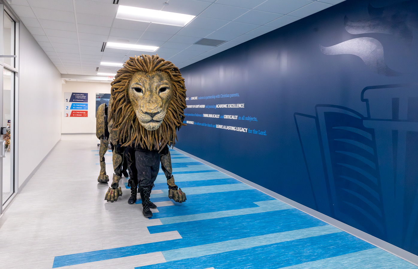 Aslan walking down an Answers Academy hallway