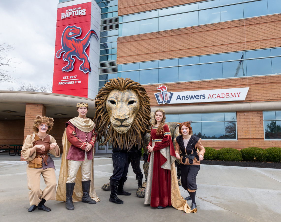 The Horse and His Boy cast and Aslan puppet in front of Answers Academy