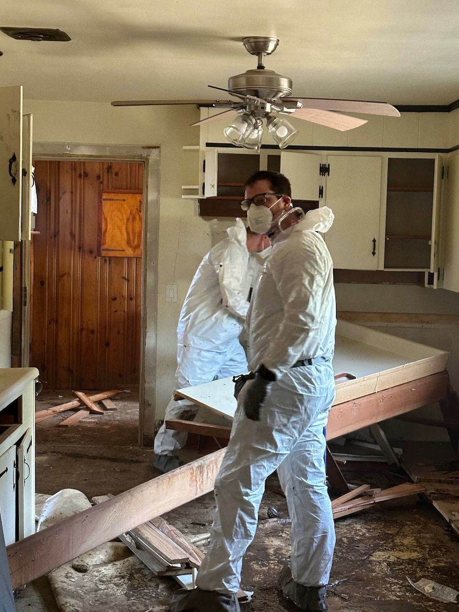 Workers in destroyed kitchen