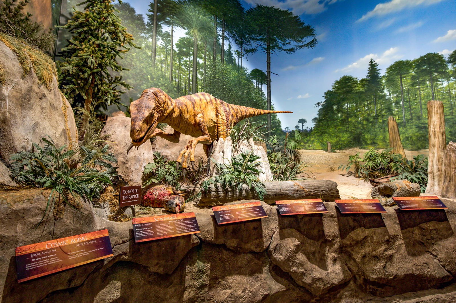 post-fall dinosaur eating meat at Creation Museum
