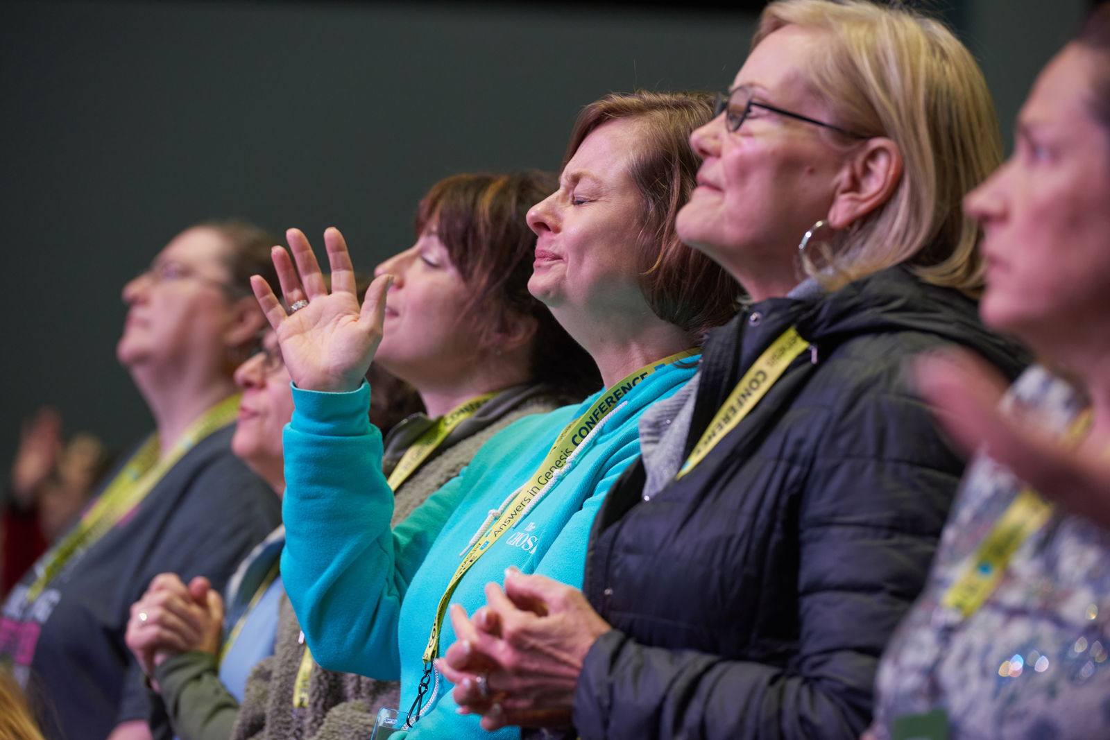 woman worshipping at our Answers for Women conference