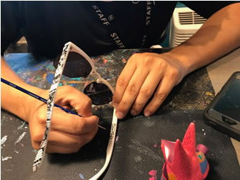 Oscar Nava Painting Sunglasses