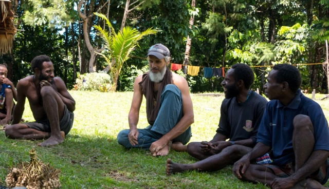 Mike with tribal people around fire