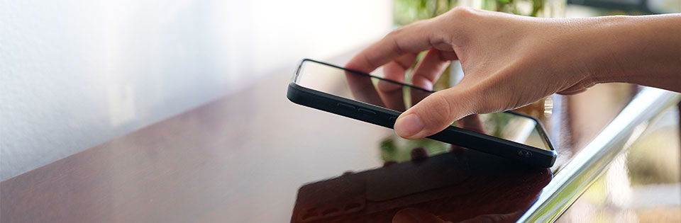 hand grabbing cell phone