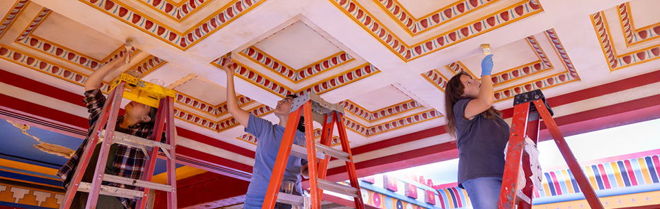 Artists painting ceiling