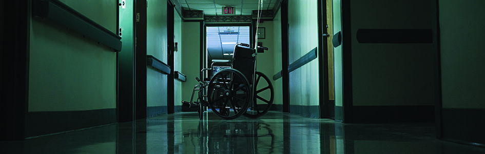 Empty wheelchair in hospital hallway